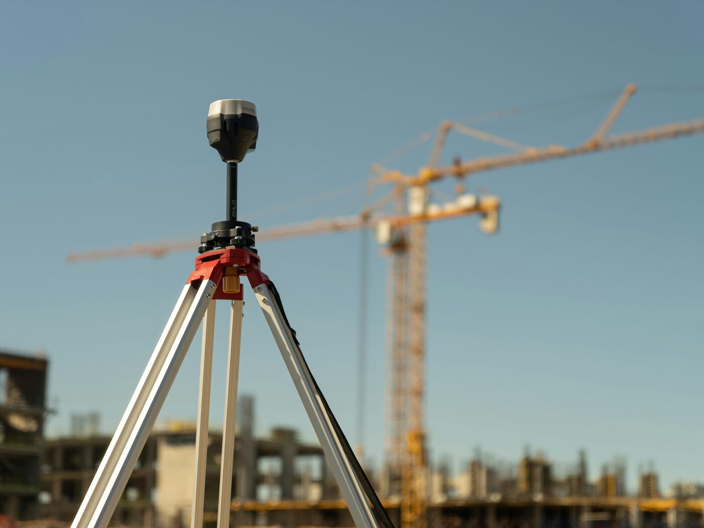 Surveying total station tripod on construction site — progeCAD civil survey software